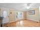 Living room with hardwood floors and fireplace at 5112 Green Leaf Ct, Mount Holly, NC 28120