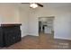 Living room with wood-burning stove and view into the kitchen at 536 Fourth St # 9, Chester, SC 29706
