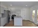 Updated kitchen with gray cabinets, granite countertops, and island at 536 Fourth St # 9, Chester, SC 29706