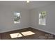 Bedroom with hardwood floors and two windows offering natural light at 536 Fourth St # 9, Chester, SC 29706