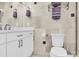 Modern bathroom with white cabinets, marble countertops, and tiled shower at 6920 Stillmeadow Dr, Charlotte, NC 28277