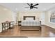 Comfortable bedroom with king bed, hardwood floors and ceiling fan at 6920 Stillmeadow Dr, Charlotte, NC 28277