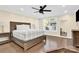 Spacious bedroom with king bed, hardwood floors and large window at 6920 Stillmeadow Dr, Charlotte, NC 28277