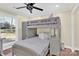 Bedroom with a built-in bunk bed and wood floors at 6920 Stillmeadow Dr, Charlotte, NC 28277