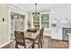 Charming dining area with sliding glass doors leading to backyard at 6920 Stillmeadow Dr, Charlotte, NC 28277