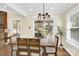 Bright dining area with hardwood floors and access to a patio at 6920 Stillmeadow Dr, Charlotte, NC 28277