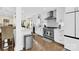 Modern kitchen with stainless steel appliances and white cabinetry at 6920 Stillmeadow Dr, Charlotte, NC 28277