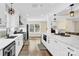 Spacious kitchen with white cabinets, quartz countertops and stainless steel appliances at 6920 Stillmeadow Dr, Charlotte, NC 28277