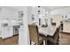 Eat-in kitchen with large island and modern pendant lighting at 6920 Stillmeadow Dr, Charlotte, NC 28277