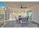 Relaxing screened porch with ceiling fan and patio furniture at 6920 Stillmeadow Dr, Charlotte, NC 28277