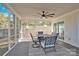 Relaxing screened porch with ceiling fan and patio furniture at 6920 Stillmeadow Dr, Charlotte, NC 28277