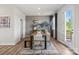 Bright dining room with wooden table, bench seating, and access to a deck at 7112 Brookview Ln, Sherrills Ford, NC 28673