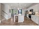 Modern kitchen with island, white cabinets, and stainless steel appliances at 7112 Brookview Ln, Sherrills Ford, NC 28673