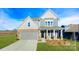 Two story home with gray siding, stone accents and landscaping at 8024 Plymouth Dr, Sherrills Ford, NC 28673