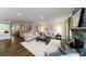 Spacious living room with hardwood floors, stone fireplace, and large windows at 8024 Plymouth Dr, Sherrills Ford, NC 28673
