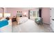Charming bedroom with pink walls, teal headboard and window seat at 8024 Plymouth Dr, Sherrills Ford, NC 28673