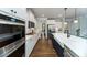 Modern kitchen with white shaker cabinets, stainless steel appliances, and hardwood floors at 8024 Plymouth Dr, Sherrills Ford, NC 28673
