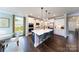 Modern kitchen with large island, stainless steel appliances, and white cabinets at 8024 Plymouth Dr, Sherrills Ford, NC 28673