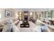 Open concept living room and dining area with stone fireplace and hardwood floors at 8024 Plymouth Dr, Sherrills Ford, NC 28673