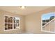 Bright bedroom with two large windows and neutral walls at 1032 Yellow Daisy Dr, Matthews, NC 28104