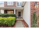 Neat walkway leading to a charming front door with brick and siding at 1032 Yellow Daisy Dr, Matthews, NC 28104