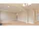 Bright living room features hardwood floors and an archway leading to the kitchen at 1032 Yellow Daisy Dr, Matthews, NC 28104