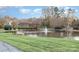 Community pond with fountain and seating area at 141 Oak Village Pkwy, Mooresville, NC 28117