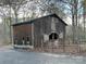 Rustic barn with gated entry and small windows at 143 Ponokah Ln, Statesville, NC 28677