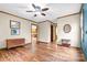 Spacious bedroom with hardwood floors and ceiling fan at 143 Ponokah Ln, Statesville, NC 28677