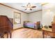Hardwood floor bedroom with window and ceiling fan at 143 Ponokah Ln, Statesville, NC 28677