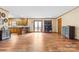 Spacious living area with hardwood floors, a kitchen, and access to a deck at 143 Ponokah Ln, Statesville, NC 28677