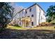 Two-story home with rear view featuring a large deck and attached garage at 314 Henry Chapel Rd, Belmont, NC 28012