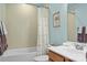 Clean bathroom with a shower/tub combo and light-colored tile at 7520 Berkeley W Rd, Denver, NC 28037