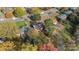 Aerial view of the house and surrounding properties, showcasing ample green space at 1532 Starbrook Dr, Charlotte, NC 28210