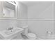 Basement bathroom with pedestal sink, toilet and shower at 1532 Starbrook Dr, Charlotte, NC 28210