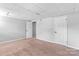 Finished basement bedroom with carpet, neutral walls and two closets at 1532 Starbrook Dr, Charlotte, NC 28210