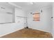 Basement laundry room with shelving and window at 1532 Starbrook Dr, Charlotte, NC 28210