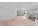 Spacious finished basement with tile and carpeted floors, wet bar and sliding glass doors at 1532 Starbrook Dr, Charlotte, NC 28210