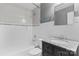 Clean bathroom, granite vanity, and white tile shower/tub combo at 1532 Starbrook Dr, Charlotte, NC 28210