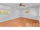 Bright bedroom with hardwood floors and ceiling fan at 1532 Starbrook Dr, Charlotte, NC 28210