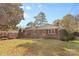 Ranch home with brick facade and well-manicured lawn at 1532 Starbrook Dr, Charlotte, NC 28210