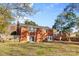 Brick house exterior with large backyard and mature trees at 1532 Starbrook Dr, Charlotte, NC 28210