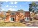 Brick house exterior with sliding glass doors and private backyard at 1532 Starbrook Dr, Charlotte, NC 28210