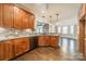 Modern kitchen featuring hardwood floors and an island at 21210 Bethel Church Rd, Cornelius, NC 28031