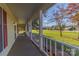 Spacious front porch with white railings overlooking yard at 2216 Lowell Bethesda Rd, Gastonia, NC 28056