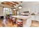 Spacious kitchen with white cabinets, quartz countertops and breakfast bar at 3708 Piaffe Ave, Mint Hill, NC 28227