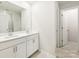 Clean bathroom with double vanity and bright lighting at 4020 Bufflehead Dr, Charlotte, NC 28269