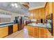 Kitchen features wood cabinets, black appliances, and green countertops at 465 Lakedale Dr, Clover, SC 29710