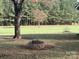 Stone fire pit in a spacious backyard at 6650 Sherrills Ford Rd, Salisbury, NC 28147