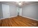 Bright bedroom with hardwood floors and ample closet space at 1032 Old Charlotte Rd, Concord, NC 28027